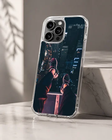Urban photography of dangling legs overlooking a city at night on a phone case — Hero
