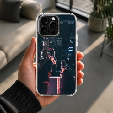 Urban photography of dangling legs overlooking a city at night on a phone case — Lifestyle