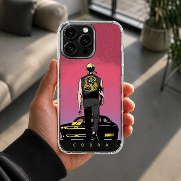 Illustrated graphic of a martial artist walking toward a muscle car under a pink sky on a phone case — Lifestyle