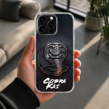 Cobra Kai phone case featuring a textured metallic snake emblem and bold white script over a dark background — Lifestyle