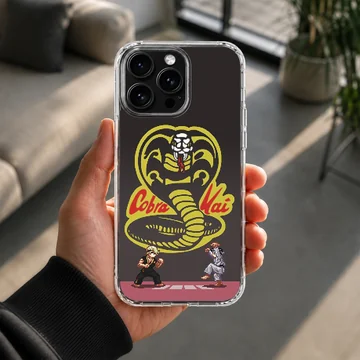 Pixel art cobra symbol and martial artists printed on a matte phone case — Lifestyle