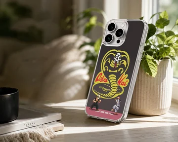 Pixel art cobra symbol and martial artists printed on a matte phone case — Lifestyle