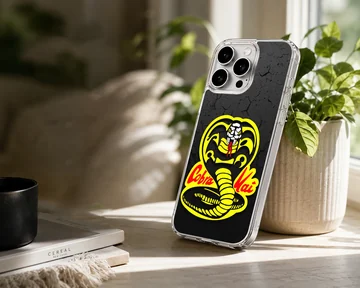 Cobra Kai snake logo illustration in yellow and red on a textured black background phone case — Lifestyle