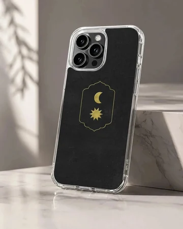 Celestial gold moon and sun emblem on a matte black phone case