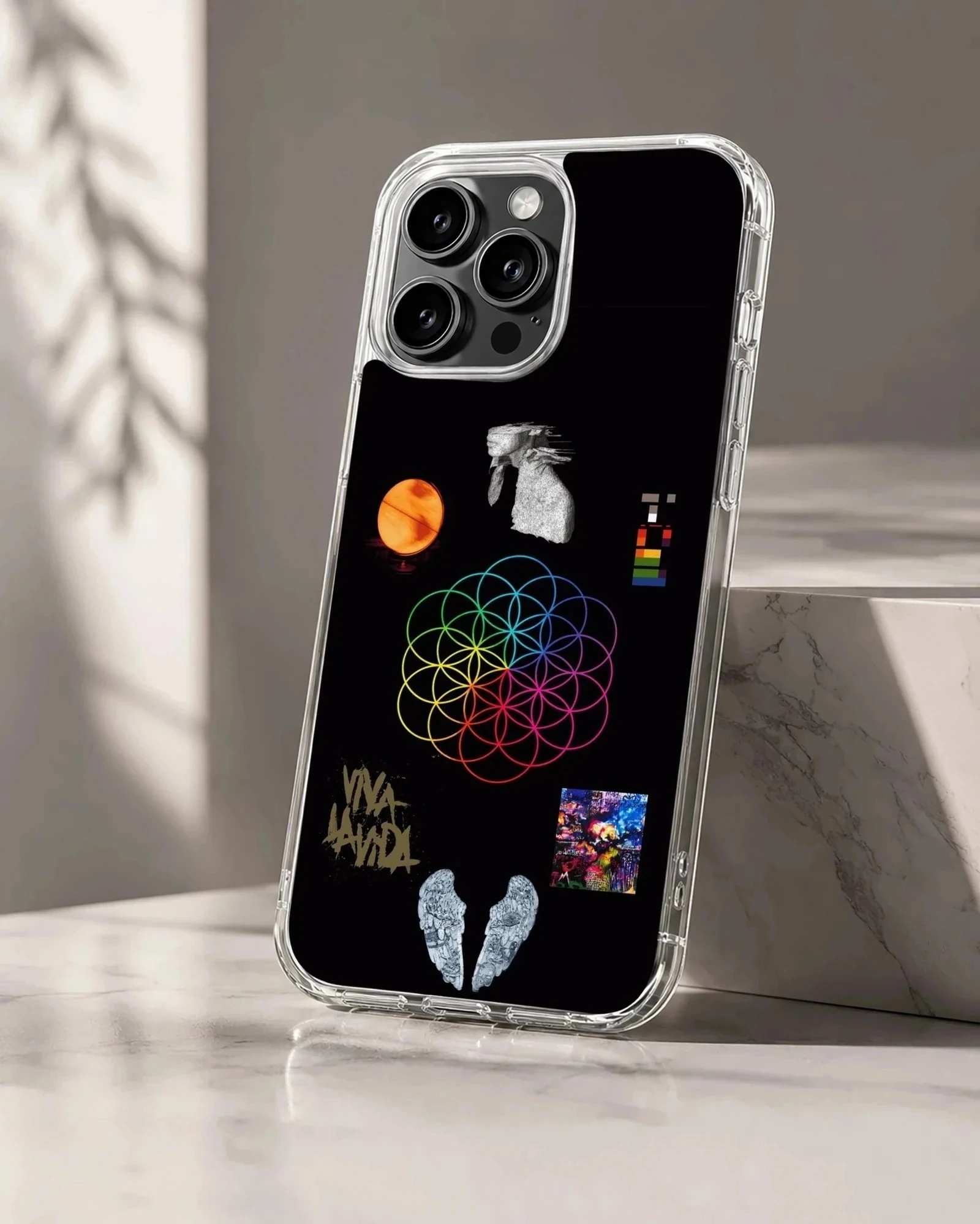 Coldplay collage music icons phone case featuring colorful geometric floral motif and artistic symbols