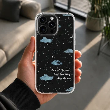 A celestial phone case featuring starry night skies, blue clouds, and handwritten song lyrics on a black background — Lifestyle