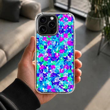 A close-up view of an abstract multicolored dot pattern phone case featuring vibrant blue, purple, and green spots. — Lifestyle