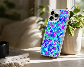 A close-up view of an abstract multicolored dot pattern phone case featuring vibrant blue, purple, and green spots. — Lifestyle