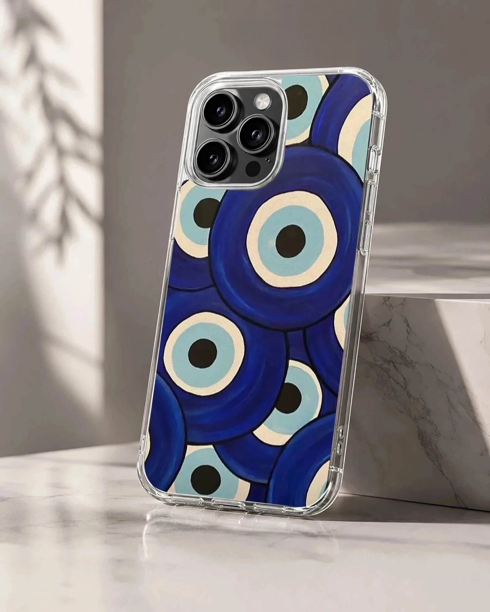 A protective snap phone case featuring an abstract pattern of layered blue evil eye symbols, phone case