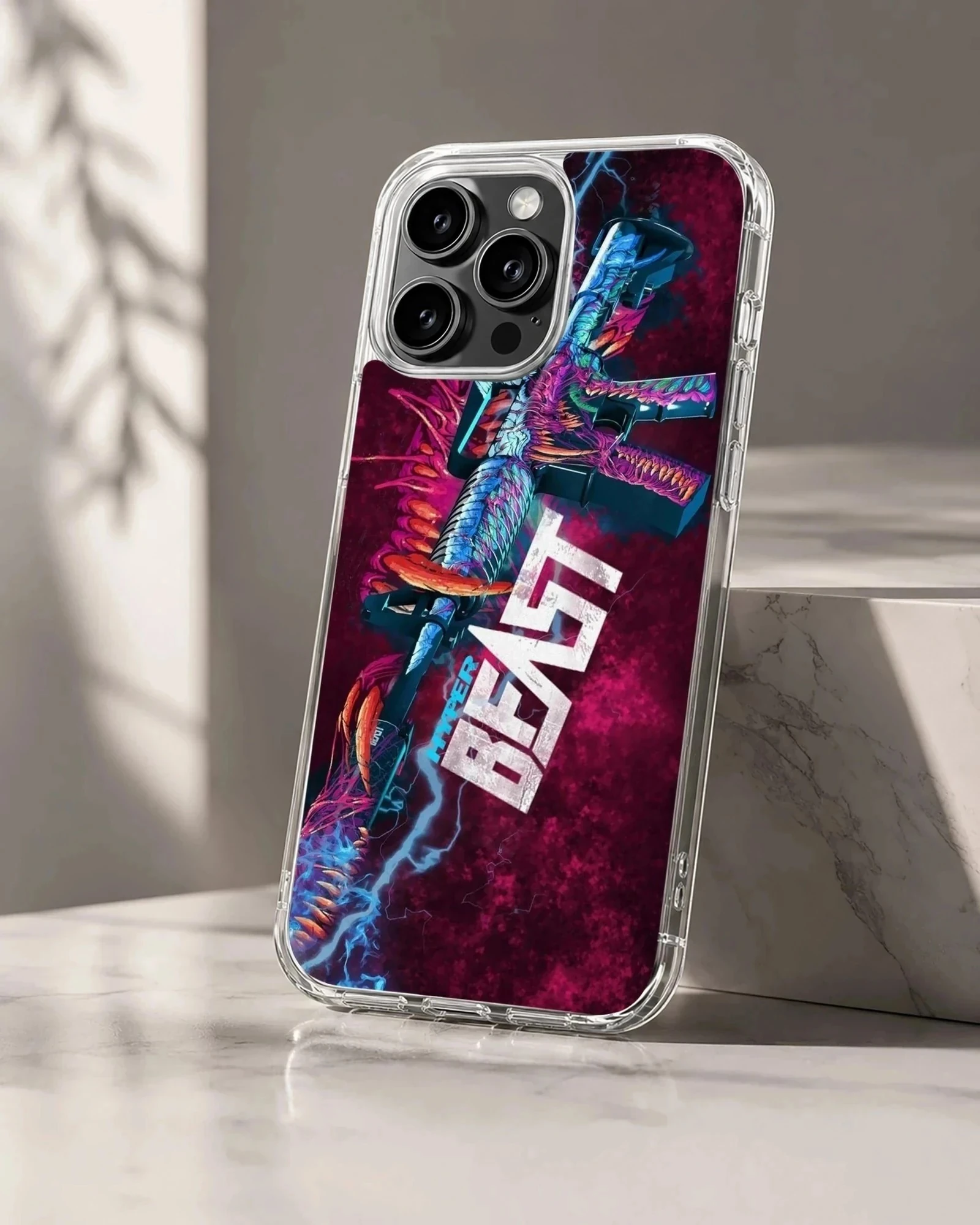 A gaming phone case featuring a neon monster rifle design with bold 'Hyper Beast' text against a purple background.