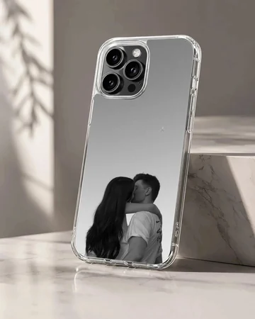 Black and white photograph of a young couple kissing against a minimalist gray background printed on a phone case
