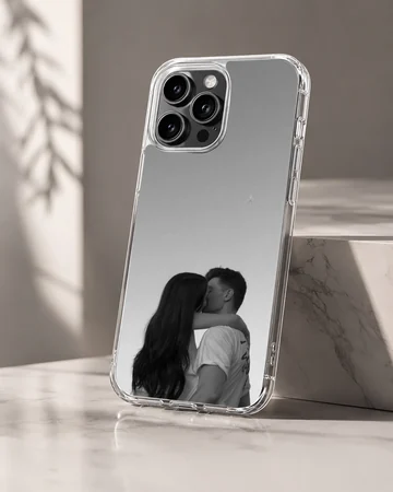 Black and white photograph of a young couple kissing against a minimalist gray background printed on a phone case — Hero