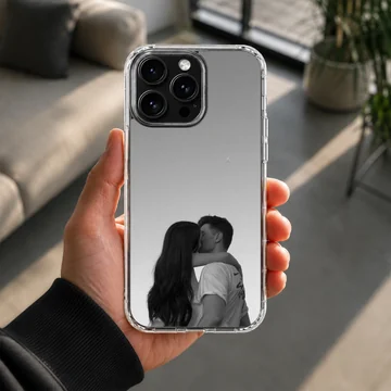 Black and white photograph of a young couple kissing against a minimalist gray background printed on a phone case — Lifestyle