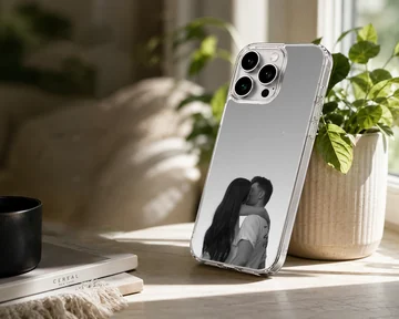 Black and white photograph of a young couple kissing against a minimalist gray background printed on a phone case — Lifestyle