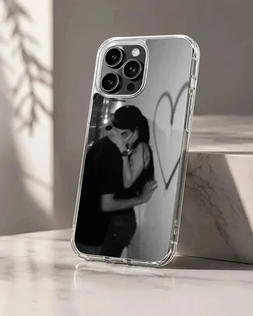 Black and white photographic design of an embracing couple next to a hand-drawn heart on a romantic phone case.