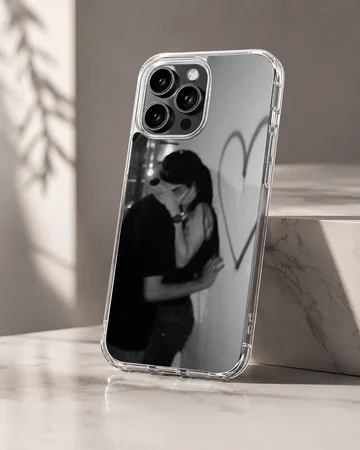 Black and white photographic design of an embracing couple next to a hand-drawn heart on a romantic phone case. — Hero