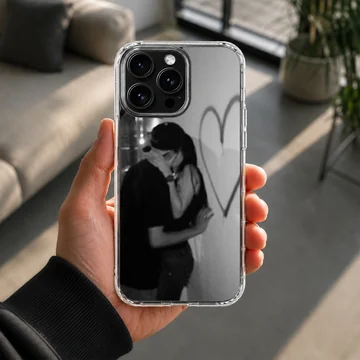 Black and white photographic design of an embracing couple next to a hand-drawn heart on a romantic phone case. — Lifestyle