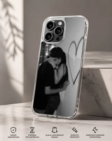 Black and white photographic design of an embracing couple next to a hand-drawn heart on a romantic phone case. — Specs