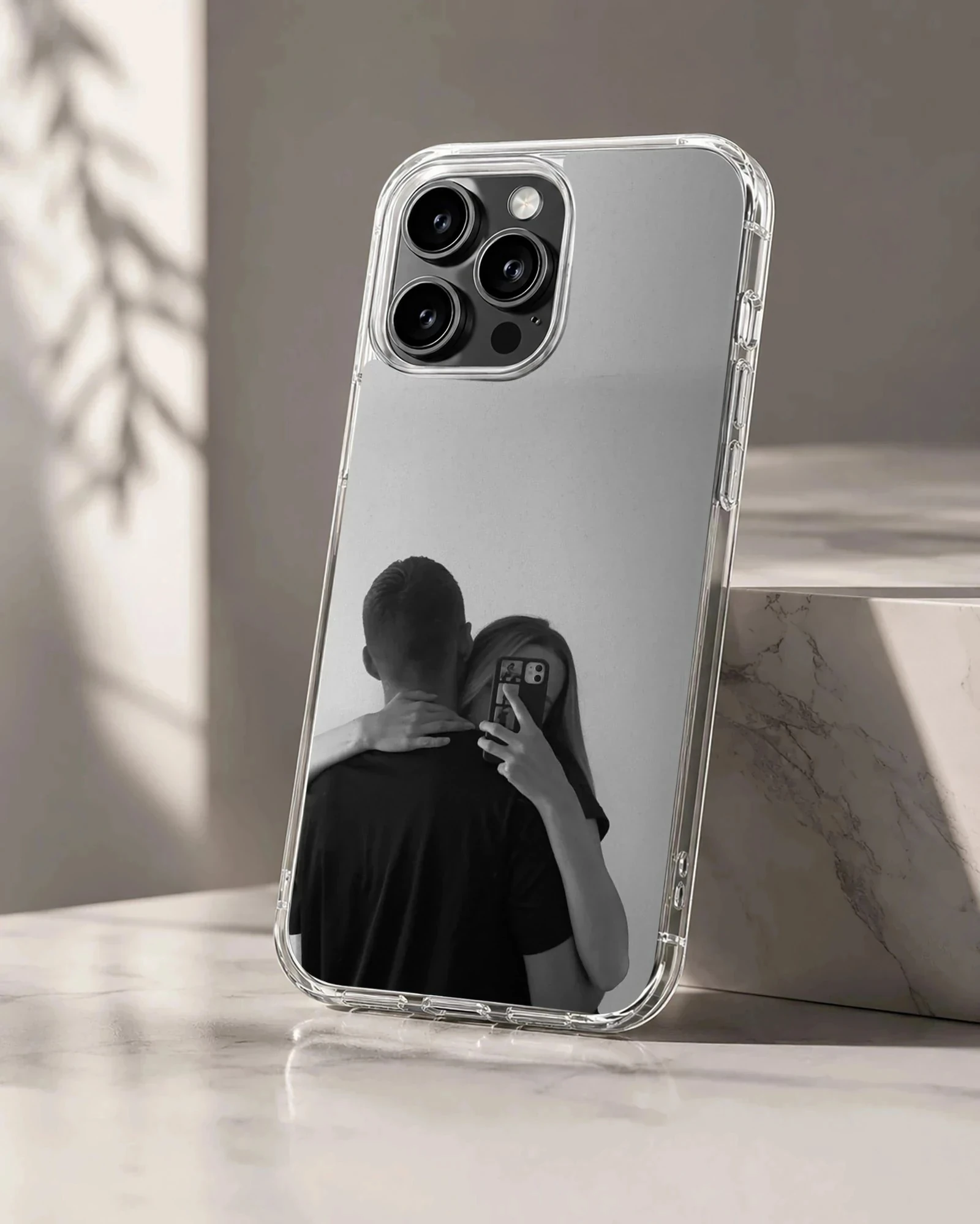 Black and white photographic art of a hugging couple taking a mirror selfie printed on a phone case