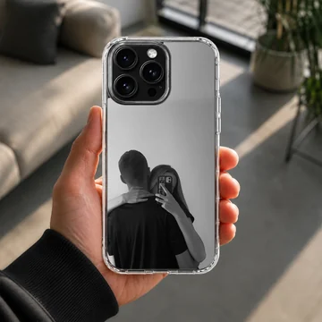 Black and white photographic art of a hugging couple taking a mirror selfie printed on a phone case — Lifestyle