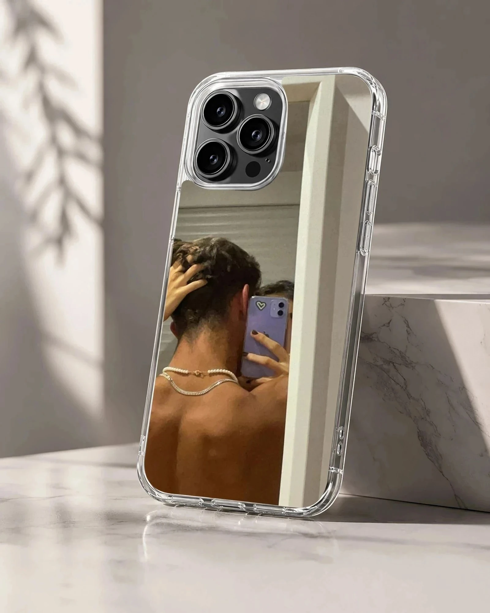 Photographic print of a couple taking an intimate mirror selfie, printed on a protective phone case