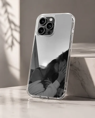 Black and white photograph of an intimate couple kissing printed on a phone case — Hero