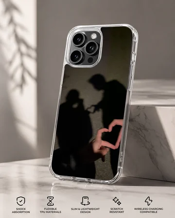 A photographic print of a couple's shadow forming a heart shape, featured on a matte phone case. — Specs