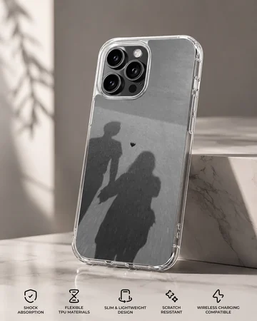 Shadow silhouette of a couple holding hands with a small floating heart, printed on a matte monochrome phone case. — Specs