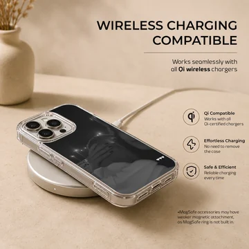 Black and white photographic print of a couple embracing at night with three small white hearts on a phone case. — Charging