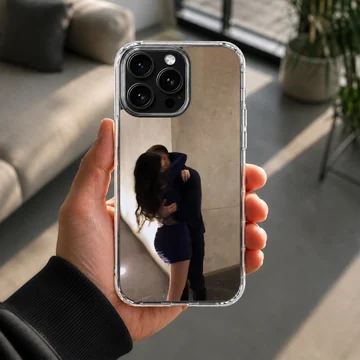 Photographic print of a couple embracing intimately against a warm neutral wall on a protective phone case. — Lifestyle