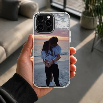 Photographic print of a young couple kissing on a beach at sunset, featured on a matte-finish phone case — Lifestyle