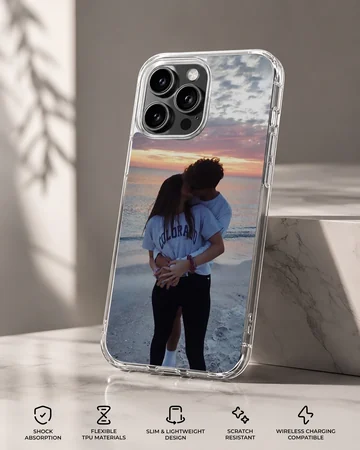 Photographic print of a young couple kissing on a beach at sunset, featured on a matte-finish phone case — Specs