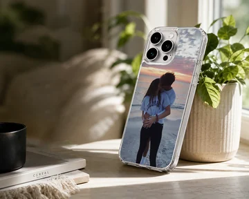 Photographic print of a young couple kissing on a beach at sunset, featured on a matte-finish phone case — Lifestyle