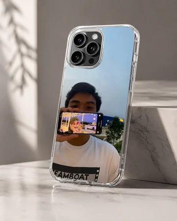 A photographic print of a couple showing a picture-in-picture phone screen selfie on a soft TPU snap phone case — Hero