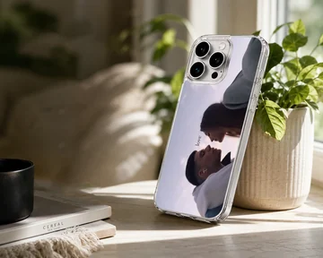 Serene couple sharing a moment with the word love on a phone case — Lifestyle