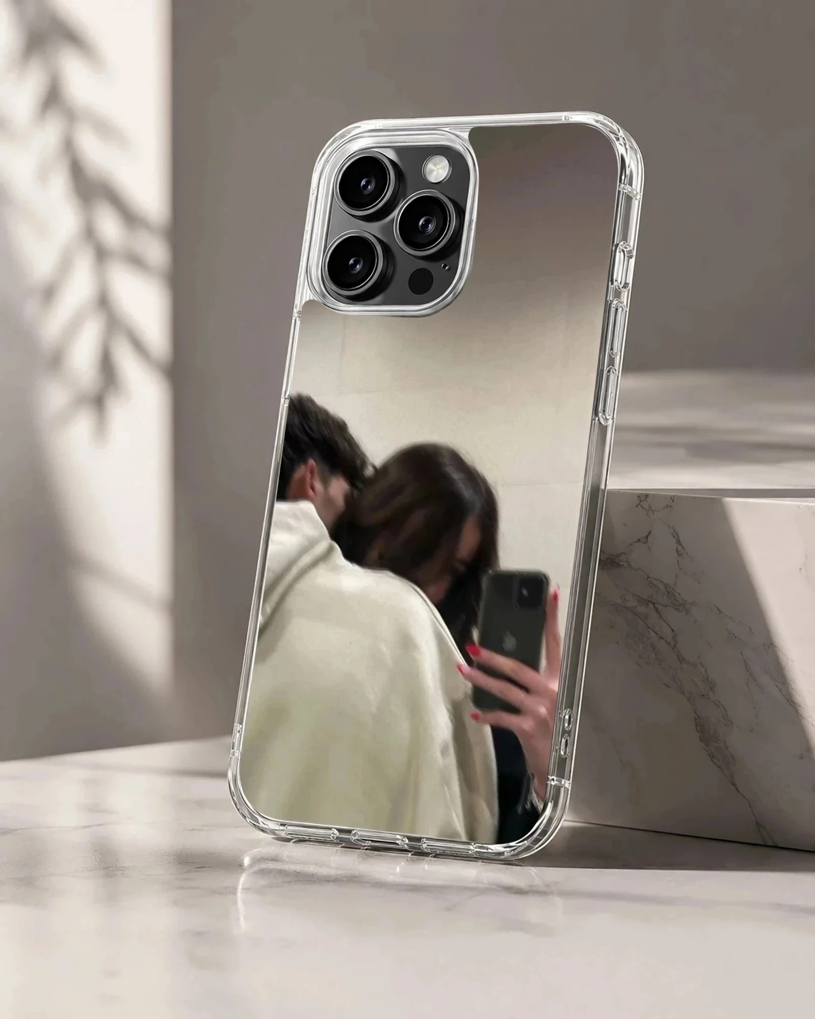 A cozy mirror selfie artwork of a couple embracing in neutral hoodie tones printed on a phone case.