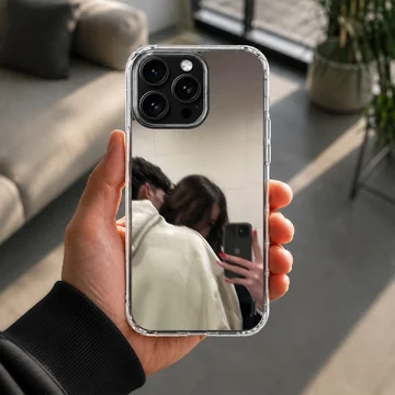 A cozy mirror selfie artwork of a couple embracing in neutral hoodie tones printed on a phone case. — Lifestyle