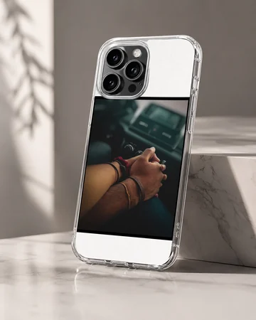 Close up photograph of a couple holding hands in a car printed on a sleek phone case — Hero