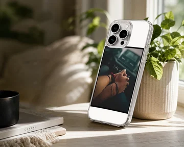 Close up photograph of a couple holding hands in a car printed on a sleek phone case — Lifestyle