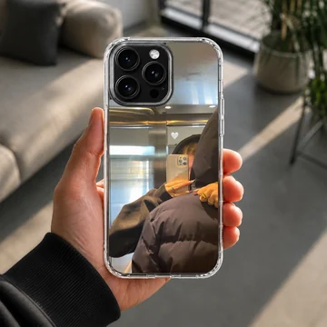 A photographic print of a couple taking a cozy elevator mirror selfie with a subtle white heart graphic phone case — Lifestyle