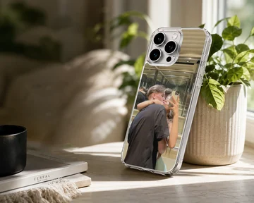 Photographic print of a young couple kissing while taking a mirror selfie in an elevator on a custom phone case — Lifestyle