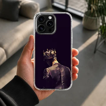 Artwork of a tailored figure wearing a glowing golden crown viewed from behind printed on a phone case — Lifestyle
