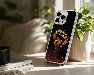 A majestic crown held firmly in a hand, printed on a phone case — Lifestyle