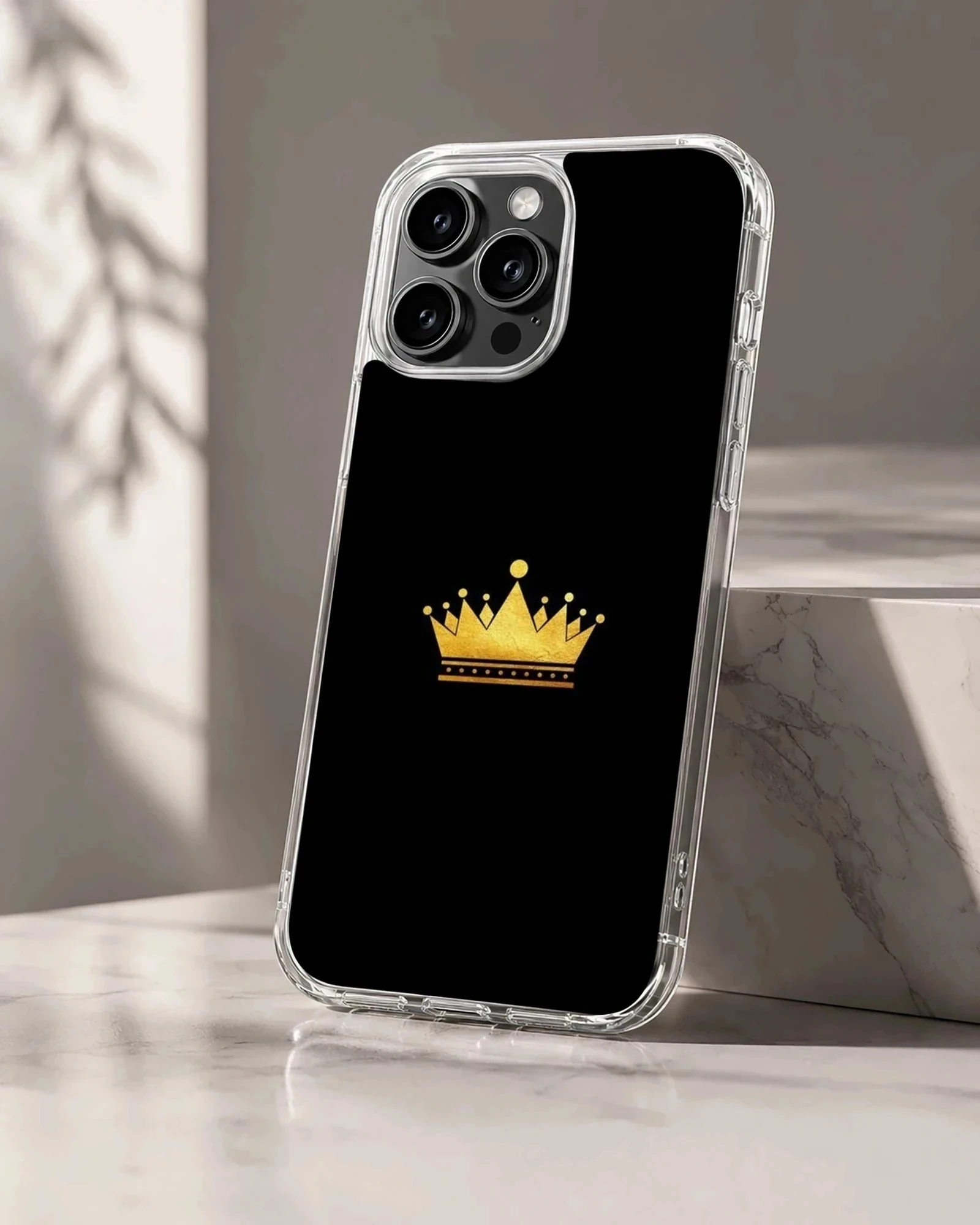 Gold crown design on black background phone case