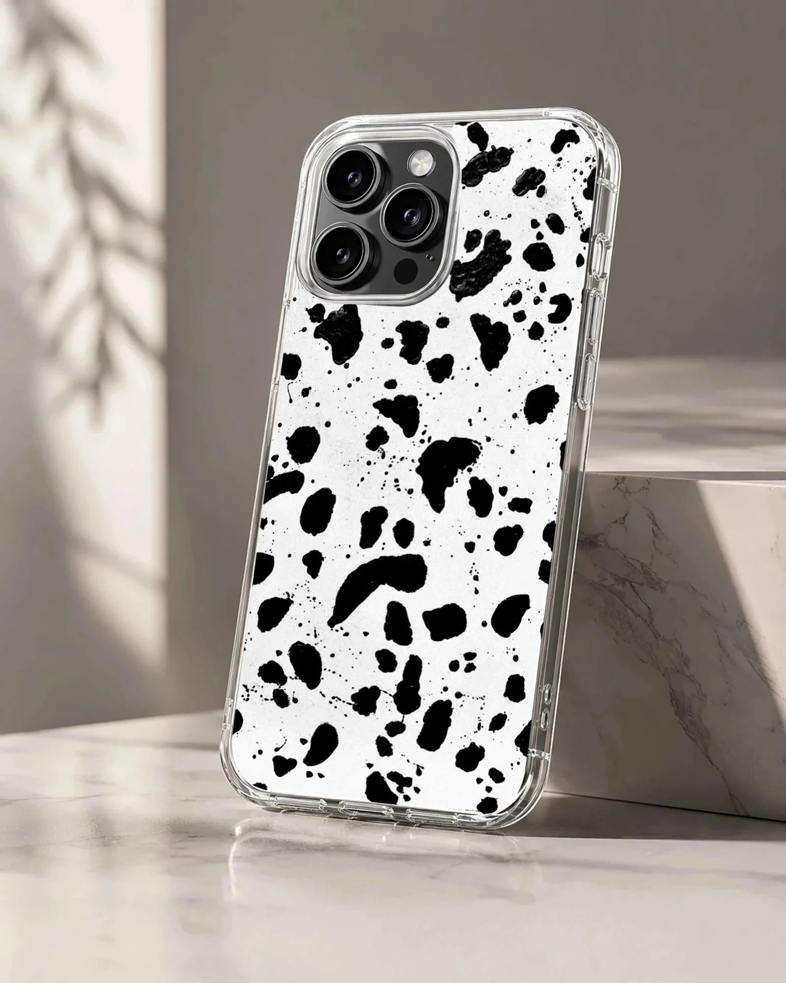 Black and white splatter design on Cruella De Vil phone case