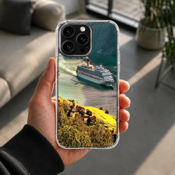 A cruise ship sailing through a picturesque harbor surrounded by green hills phone case — Lifestyle