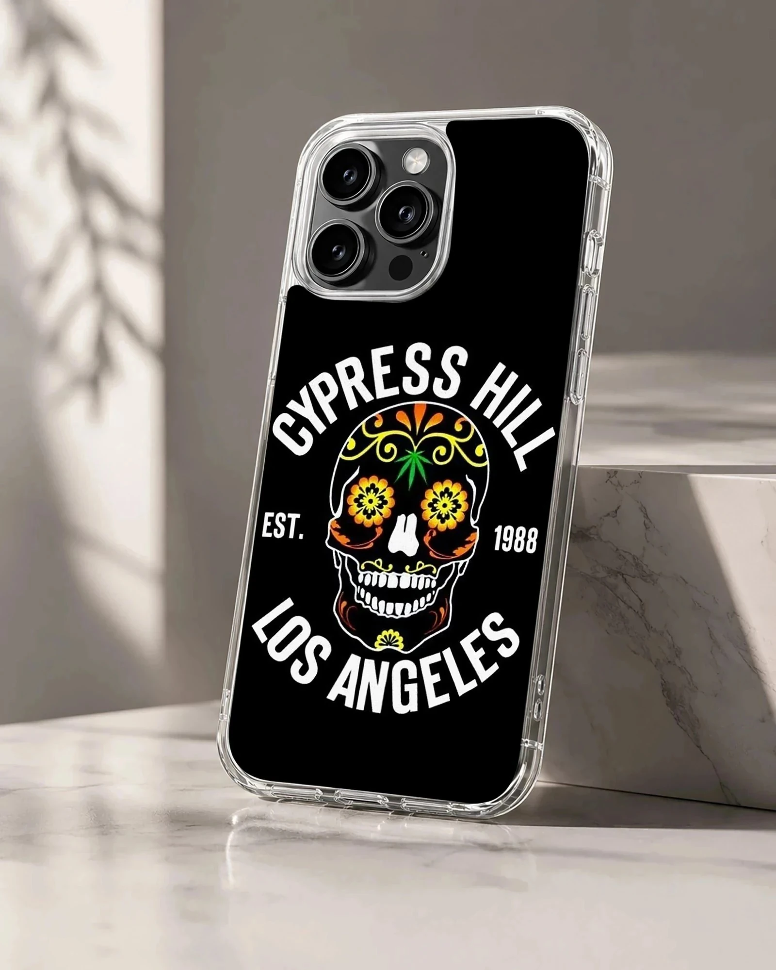 Bold skull design with floral accents on black phone case
