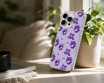 Gengar cartoon pattern with Poké Balls in purple on phone case — Lifestyle