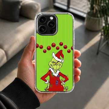 Grinch in festive attire with green background and red ornaments phone case — Lifestyle