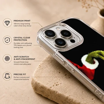 Grinch holding ornament in holiday-themed phone case — Info